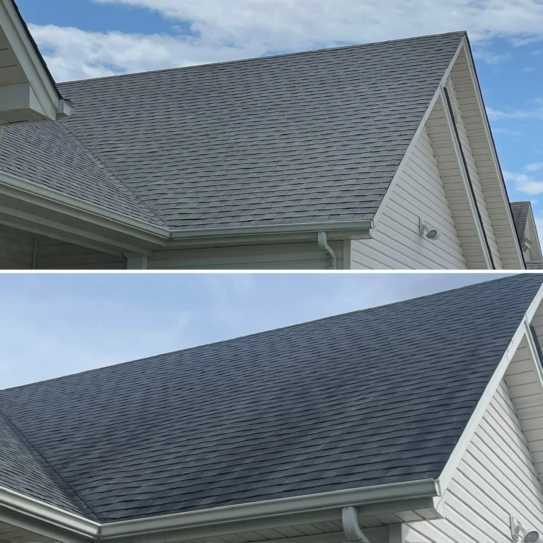 Clean gray asphalt shingle roof with white gutters and siding on residential home