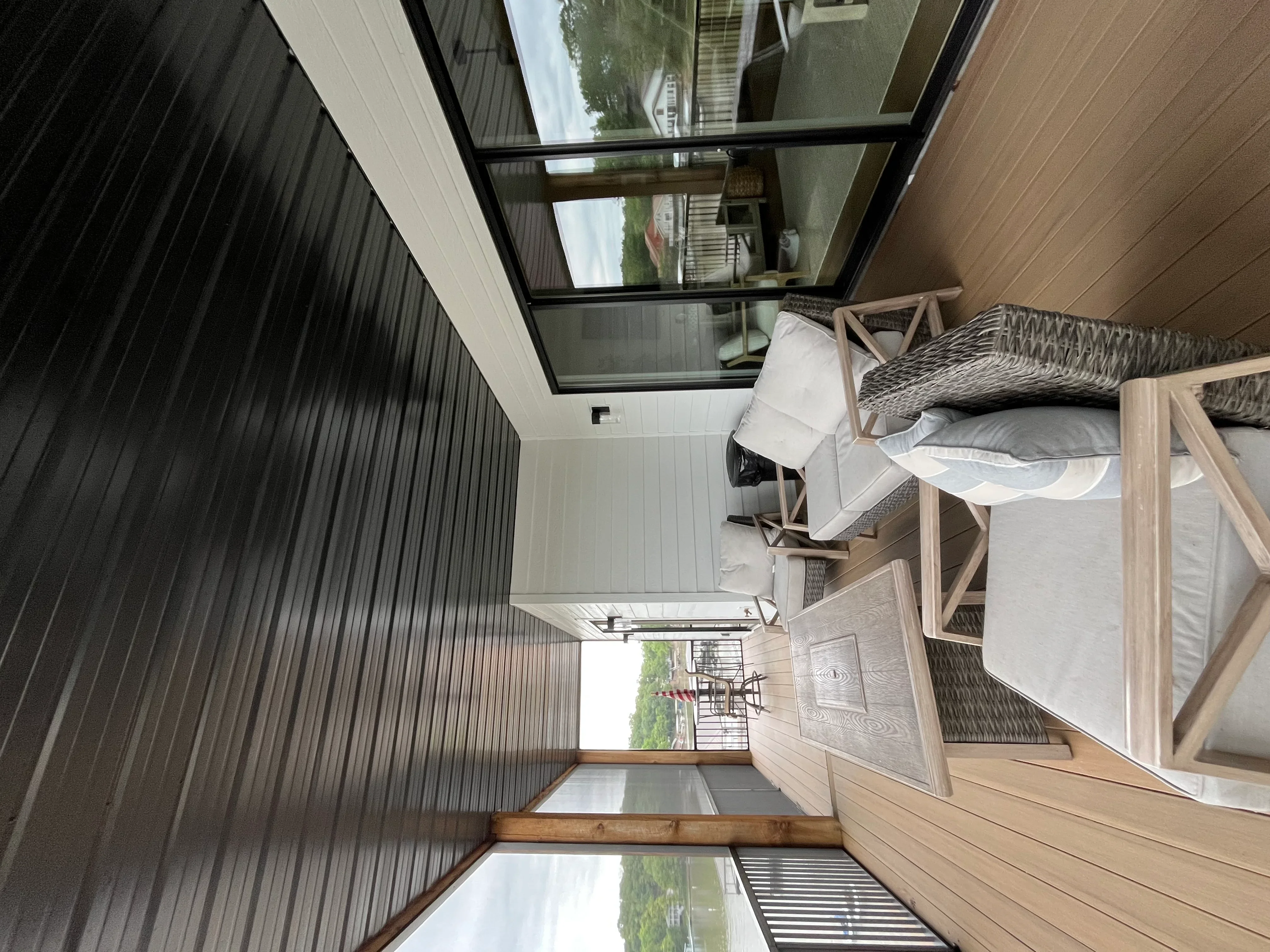 Clean residential home exterior with metal siding and white soffit after professional pressure washing service