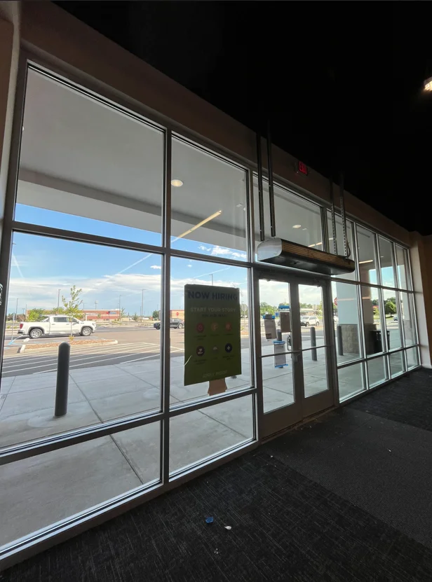 Clean commercial storefront with multi-pane glass windows and aluminum frames