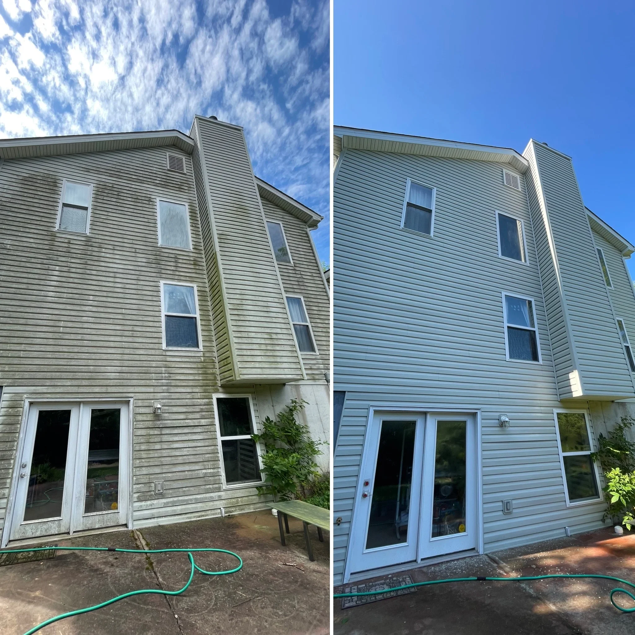 Before and after soft wash cleaning of blue vinyl siding on two-story home