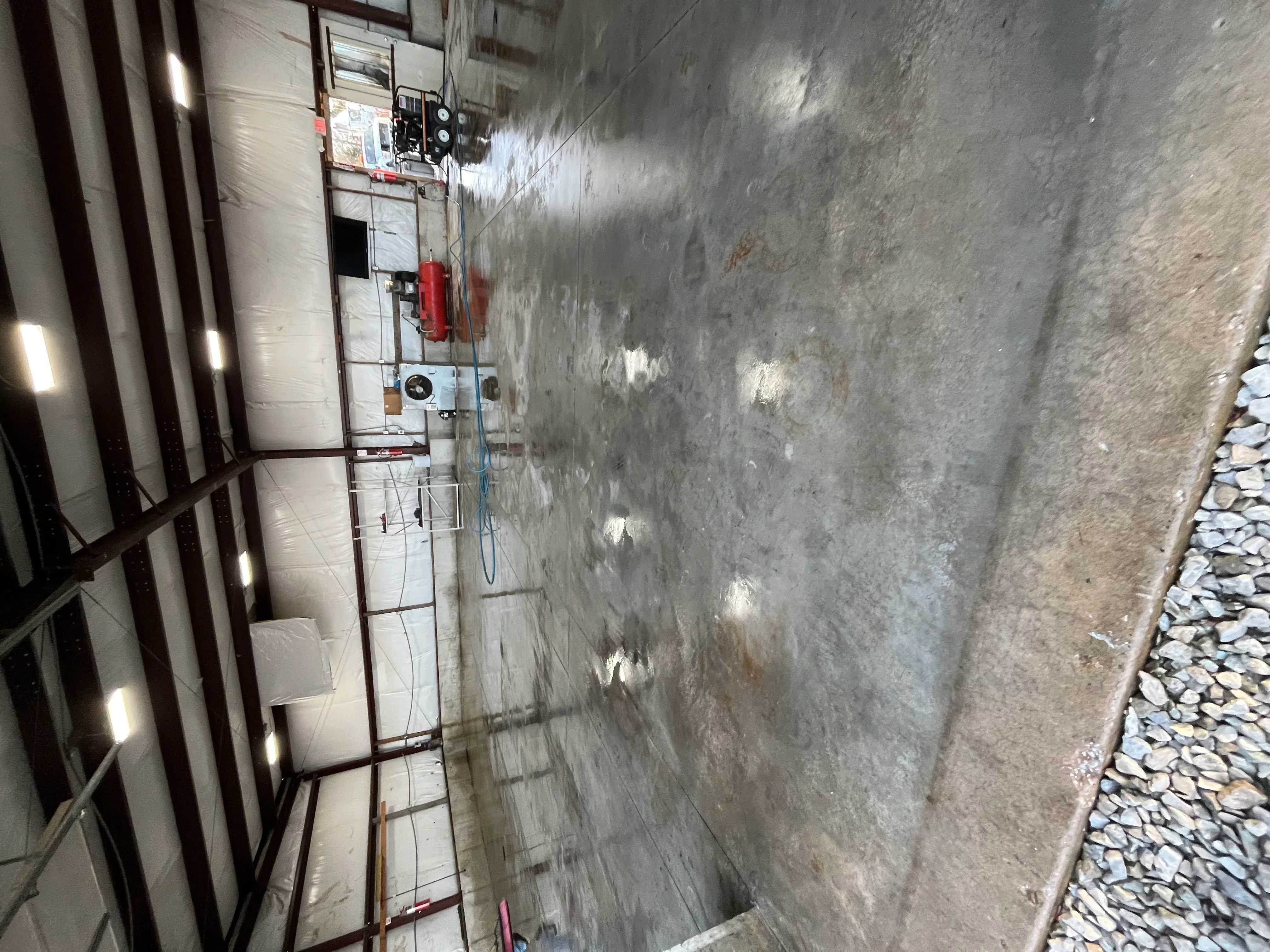 Clean concrete driveway and foundation after professional pressure washing service